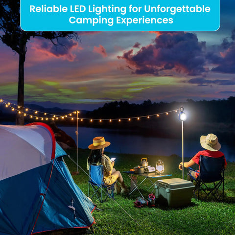 People camping at dusk with LED lights, sitting near a tent and table, surrounded by camping gear and illuminated by string lights.