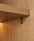Wooden shelf supported by 24 Pack Cabinet Shelf Support Pins One Quarter Inch Carbon Steel With Rubber Covers For Stability And Precise Shelf Positioning.