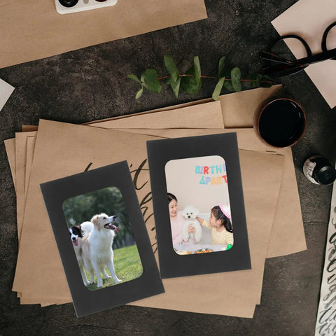 Black Window Envelopes Set 30 Pack Small Size For Business Cards Photos And Invitations with clear windows on a desk