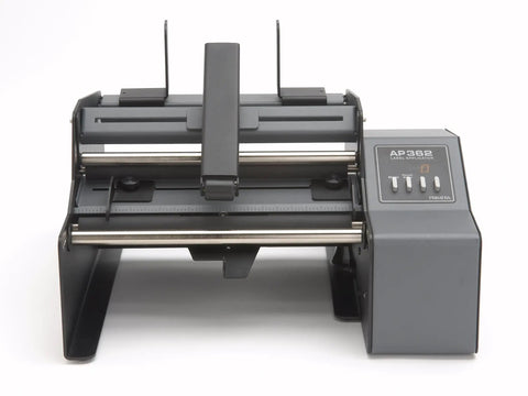Hustle Ready Semi Automatic Label Applicator For Cylindrical Bottles Cans Jars And Tubes With No Sweat Setup and smooth operation on a flat surface.