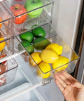Solid 4 Pack Stackable Clear Storage Drawers With Removable Dividers To Crush Household Clutter Right Now holding lemons in a fridge.