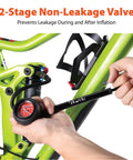 Person using High Pressure Shock Pump With Gauge For Mountain Bikes 400 PSI Front Fork And Rear Shock Inflator on a bike