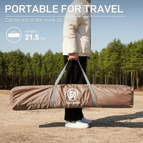 Person holding packed Pop Up Screen House Tent For Camping 11.5 By 9.8 Ft Instant Gazebo With Netting in khaki bag