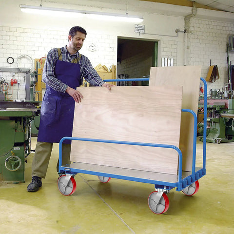 Rock Solid 8X2 Inch Swivel Casters Kingpinless Polyurethane Wheels on a workshop truck for moving plywood sheets.