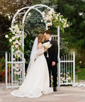 Couple under Garden Arbor With Gate PVC Frame Trellis Arch For Climbing Plants Outdoor Wedding Backdrop White Vinyl Pergola