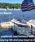 Boats on a dock with American flag by a lake, highlighting marine lifestyle and relaxation.
