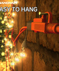 Heavy Duty 50 Ft Outdoor Extension Cord Waterproof 16 Gauge 3 Conductor SJTW in use with Christmas lights on a wall