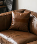 Brown leather sofa with cushion, showcasing Leather Repair Tape Self Adhesive Patch Kit 3x60 Inches Black For Furniture use.