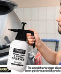 Man using Continuous Hand Pump Sprayer 1.5L for car detailing, featuring durable chemical-resistant build and adjustable nozzle.