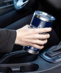 Make Every Sip Hit Different With This Dope 20 Oz Stainless Steel Tumbler Featuring Double Wall Insulation And Secure Lid For Dallas Cowboys Fans Who Want Their Coffee Tea Or Cocktails Staying Frosty All Day Long, held in a hand inside a car.