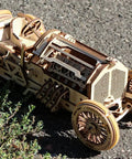 Dope Mechanical Grand Prix Car Wooden 3D Puzzle 348 Parts Build 13.8 Inch Model With Realistic V8 Engine Moving Fan 16 Valves Three Transmission Modes Rubberized Wheels Spring Front Fork Vintage Racer Look, wooden 3D car model on pavement