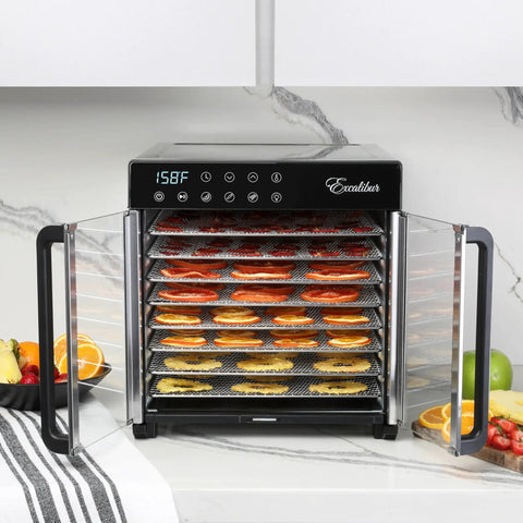 No Nonsense 8 Tray Food Dehydrator For Crankin Out Homestyle Beef Jerky Crispy Veggies And Sweet Fruit With Smart Temp Knob And 80 Hour Digital Clock Plus Hyperwave Air System displaying sliced fruits on chrome trays.