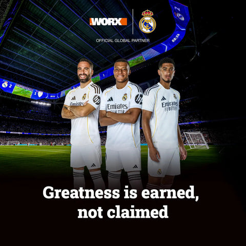 Three soccer players in white uniforms on a stadium field under stadium lights, with "Greatness is earned, not claimed" text.