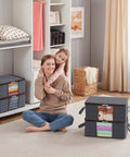 8 Pack Foldable Closet Storage Bins with Clear Windows, Reinforced Handles; shown organizing clothes in a cozy room setting.