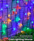 60 LED Cherry Blossom Solar String Lights Outdoor Waterproof Fairy Lights For Garden Yard Fence Patio Christmas Tree Wedding Party Decor Multicolor glowing against brick wall.