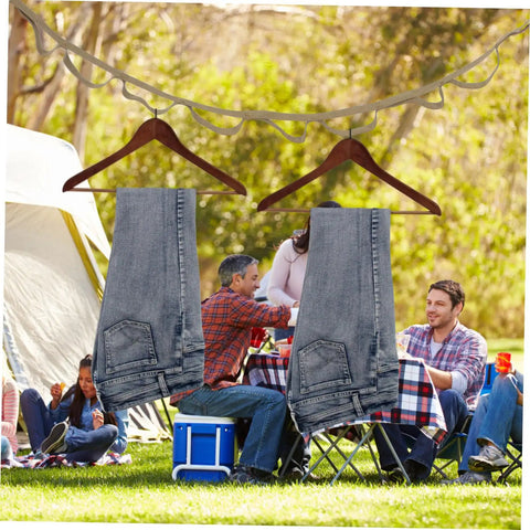 Outdoor Clothesline Rope Kit For Camping And Travel Non Slip Quick Fastening Drying Line with jeans hanging in forest camp