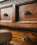 Antique Brass Cup Pulls 3 Inch Center 10 Pack Vintage Drawer Pulls For Kitchen Cabinets Bathroom Vanities And Dressers Durable Zinc Alloy Hardware Classic Cabinet Handles And Knobs With Retro Vibe And Timeless Look installed on wooden dresser drawers.