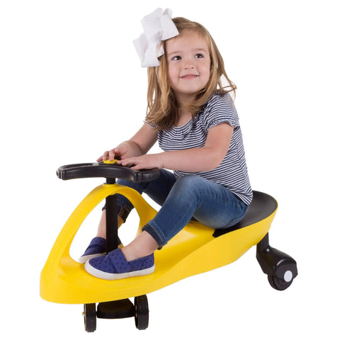 Twist And Go Wiggle Ride On Car For Kids Three Plus zero cords motor skill boosting ride with a young girl in a yellow toy.