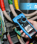 Person using Pro Grade Inrush Clamp Meter Multimeter 1000A True RMS 6000 Counts AC DC Current And Voltage Tester in electrical panel.