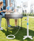 Family using Stand Up Outdoor Mister System With Adjustable 46 Inch Height 5 Brass Nozzles And 26 Foot Hose For Patio BBQ Pool And Water Activities Portable Cooling Mist That Keeps It Chill On Hot Summer Days on grass