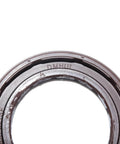 DMHUI rotary shaft oil seal; metal outer ring with rubber lip, close-up view.