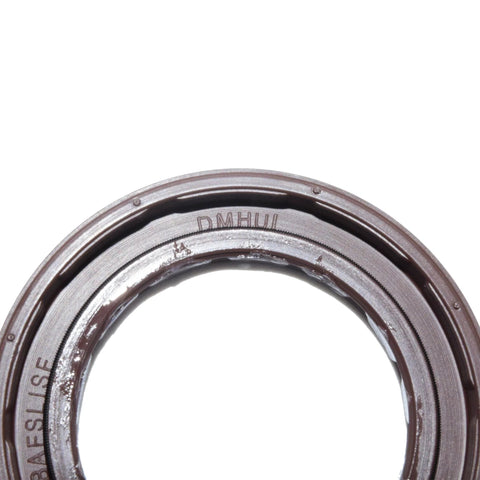 DMHUI rotary shaft oil seal; metal outer ring with rubber lip, close-up view.