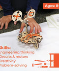 Child building a robot using Epic STEM Kit For Kids Aged 8 To 10 Build Robots Tinker Circuits And Engineer With Motors Wood Parts And Real Life Hardware Endless Hands On Projects Cool DIY Toys Perfect Gift For A 10 Year Old Boy Or Girl with wood parts and rubber bands.
