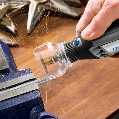 Zero Mess Spark Shield And Accessory Bundle For Rotary Tools Slick Spring Guard during use with Dremel tool on metal workpiece.