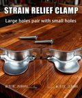Two Piece Dryer Cord Strain Relief Clamp Kit shown with screws on a wooden surface.