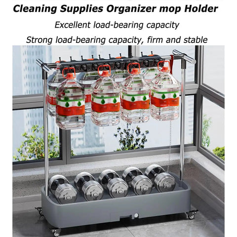 Heavy Duty Floor Mounted Mop Rack And Broom Holder With Stainless Steel Frame And Thick ABS Tray shown with cleaning supplies