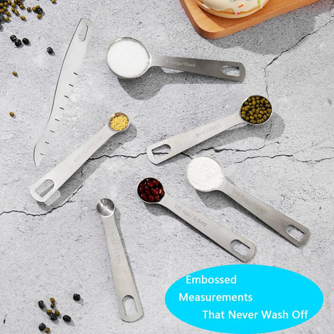 Stainless steel measuring spoons from 20 Piece Measuring Cups And Spoons Set For Cooking And Baking Gadgets on gray background.