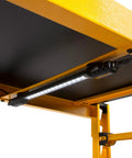 Motion Activated LED Magnetic Shelving Light Kit For Garages And Workshops attached to yellow metal shelf
