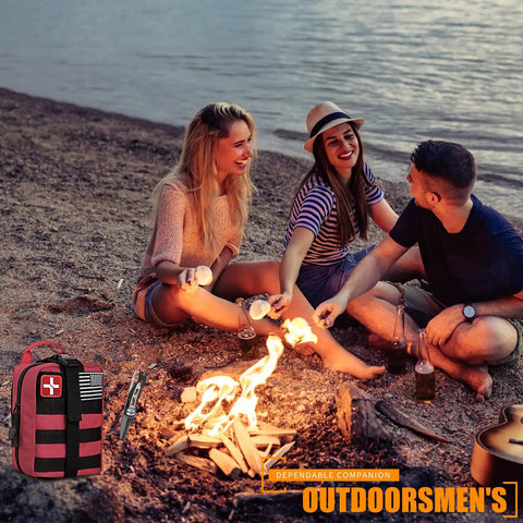 Outdoor First Aid Kit With 288 Pieces MOLLE Medical Pouch beside a campfire with three people on a beach.