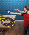 Two kids playing with Sonic And Tails RC Slot Car Set On Figure Eight Track With Working Lights on a table