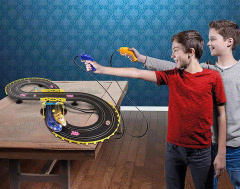 Two kids playing with Sonic And Tails RC Slot Car Set On Figure Eight Track With Working Lights on a table