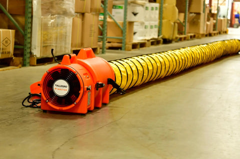 Beefy Industrial Com-Pax-Ial Blower Kit with canister and 8 inch by 25 foot duct, orange polyethylene housing, 831 CFM shown in warehouse.