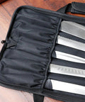 Red Knife Roll Bag With Zipper Pocket Made From Oxford Cloth holding kitchen knives for travel and culinary use