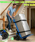 A man using an electric stair climbing dolly to lift a refrigerator upstairs, showcasing the Heavy Duty Electric Stair Climbing Dolly Cart.