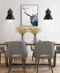 Dining room with 2 In 1 Plug In Or Hardwired Swing Arm Wall Light Sconce in Industrial Black Finish next to a deer painting