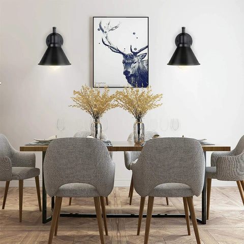 Dining room with 2 In 1 Plug In Or Hardwired Swing Arm Wall Light Sconce in Industrial Black Finish next to a deer painting