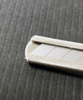 Close-up of Auto Lock Stainless Steel Utility Knife With 9mm Blade Built In Snapper Pocket Clip Ambidextrous Tool For Pros And DIYers Rust