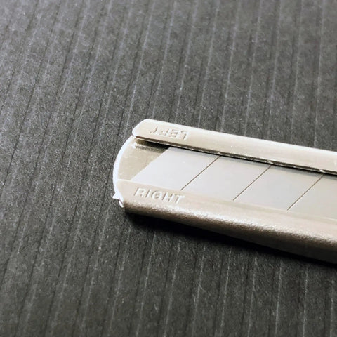 Close-up of Auto Lock Stainless Steel Utility Knife With 9mm Blade Built In Snapper Pocket Clip Ambidextrous Tool For Pros And DIYers Rust