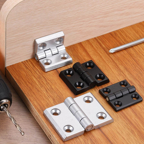 Zinc Alloy Mini Folding Hinges For Cabinets 60mm X 60mm Black Two Pack Uxcell 180 Degree Adjustable Hinges displayed on wood
