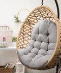 Gray thick egg chair cushion replacement for outdoor swing with button tufting plush PP cotton fill in wicker chair.