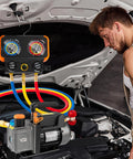 Man using R1234yf Auto HVAC Vacuum Pump And Gauge Kit with 4.5 CFM Leak Detector and hoses, car engine open