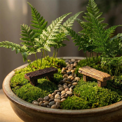 Miniature Resin Bench Set For Fairy Gardens And Dollhouses, 18 Pieces Tiny Park Benches And Chairs For Bonsai Terrariums, seen in a terrarium with moss and stones.