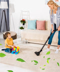 Woman vacuuming living room carpet near child playing with blocks, illustrating use of 6 Pack Reusable Paper Disc Vacuum Filter For Most Wet Dry Vacuums 5 Gallon And Up