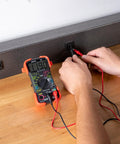Auto-Ranging Digital Multimeter For Automotive And Home Electrical Troubleshooting UL Certified in use with wall outlet.