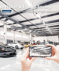 Garage with multiple cars showing Linkable 10 Pack LED Shop Lights 4 Foot, 4400 Lumens, 6500K Cool Daylight installed overhead
