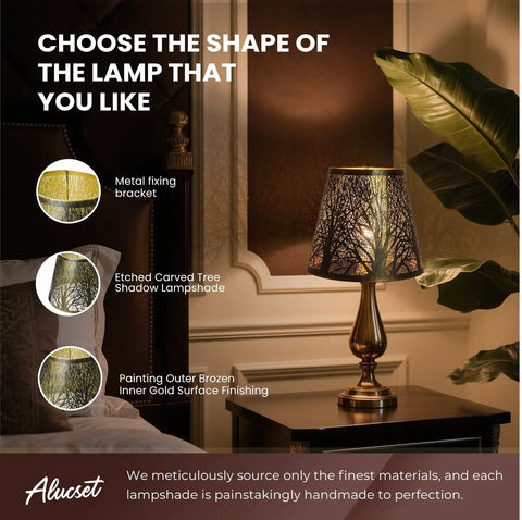 Etched tree shadow lamp with gold finish on a bedside table, highlighting decorative options and materials.